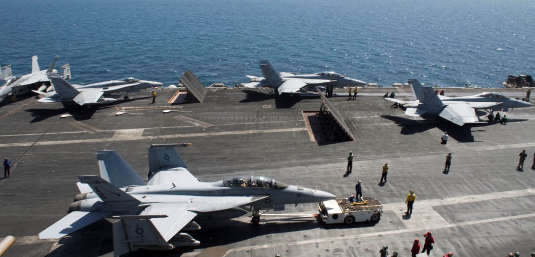 US Aircraft prepare for flight operations on the USS Theodore Roosevelt