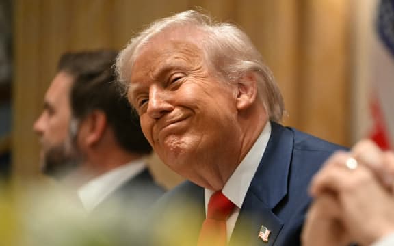 US President Donald Trump (C) smiles next to Vice President JD Vance (L) and Secretary of State Marco Rubio as they meet with Argentina's President Javier Milei in the Cabinet Room at the White House in Washington, DC, on October 14, 2025. (Photo by ANDREW CABALLERO-REYNOLDS / AFP)
