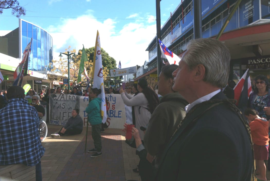 Protestors gather outside the Northland Regional Council. March organiser Millan Ruka is in the right foreground.