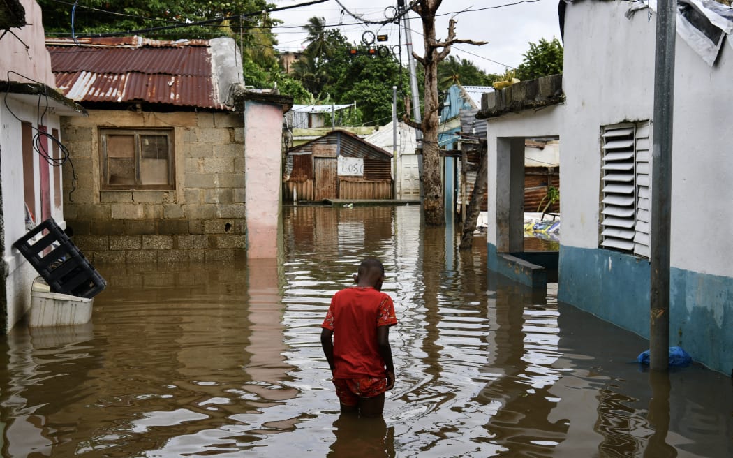 A man walks along a flooded street ahead of the arrival of Hurricane Melissa at Las Cucarachas neighbourhood in Santo Domingo, Dominican Republic on October 28, 2025.