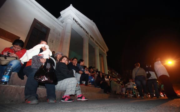 Locals in Antofagasta, Chile, take refuge.