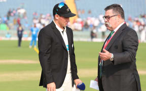 Match referee David Boon speaks to Tom Latham of New Zealand during the second test against India at Pune, India, 24 October 2024.