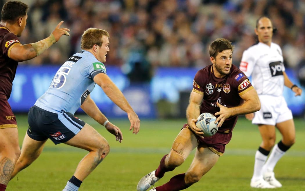 Ben Hunt, (with the ball), playing for Queensland in the year's State of Origin
