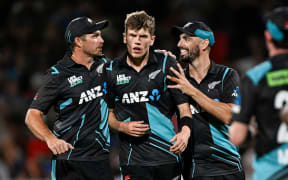 Black Caps Tim Southee, Ben Sears and Daryl Mitchell celebrate a wicket against Pakistan in the second Twenty20 international at Hamilton.