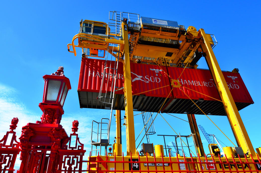 Straddle carriers and containers on Fergusson Wharf at Ports of Auckland.
