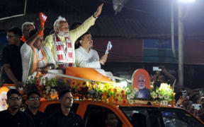 Narendra Modi, India&#039;s Prime Minister and leader of the ruling Bharatiya Janata Party (BJP), is participating in a road show with Leader of the Opposition in the West Bengal Legislative Assembly Suvendu Adhikari (Right) and BJP State President Sukanta Majumder during an election campaign ahead of the country&#039;s upcoming seventh and final phase general elections, in Kolkata, India, on May 28, 2024. (Photo by Debajyoti Chakraborty/NurPhoto) (Photo by Debajyoti Chakraborty / NurPhoto / NurPhoto via AFP)