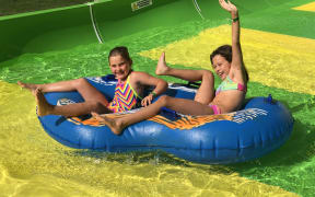 Tahlia Bresson, 8 and Tenesha Hey, 9, enjoy the Conical Thrill waterslide at Hanmer Springs on its opening day.