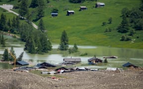 This photograph shows the small village of Blatten, in the Bietschhorn mountain of the Swiss Alps, destroyed by a landslide after part of the huge Birch Glacier collapsed and swallowed up by the river Lonza the day before, in Blatten on May 29, 2025. Swiss authorities were on May 29, 2025 monitoring for possible flood risk in a southern valley, following a massive glacier collapse that created a huge pile of debris after destroying a small village. On May 28 the Birch glacier in Switzerland's southern Wallis region collapsed, sending tons of rock, ice and scree hurtling down the mountain slope and into the valley below. The barrage largely destroyed the hamlet of Blatten, which had been home to 300 people and was evacuated last week due to the impending danger. (Photo by FABRICE COFFRINI / AFP)