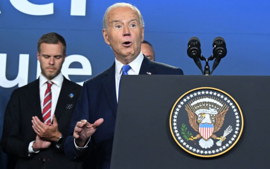 US President Joe Biden gestures after speaking during the Ukraine Compact initiative on the sidelines of the NATO Summit at the Walter E. Washington Convention Center in Washington, DC, on July 11, 2024. (Photo by SAUL LOEB / AFP)