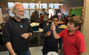 Students at Musselburgh School in Dunedin undergoing research with Dr David Warren.