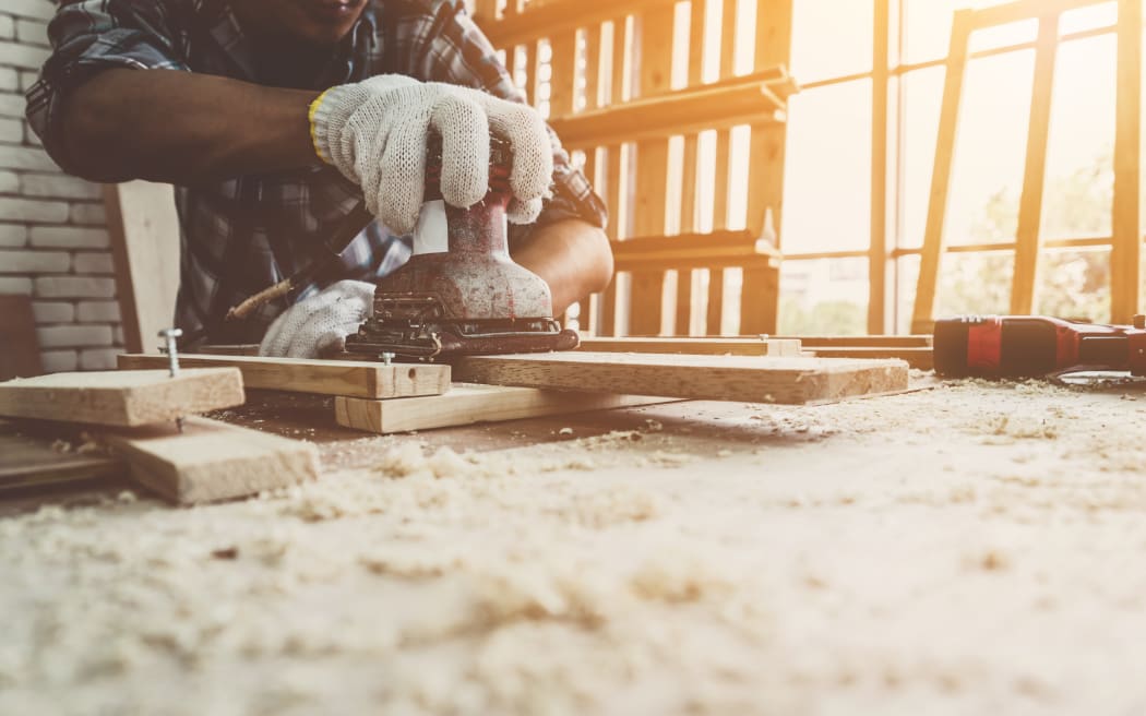 A carpenter working in a workshop.