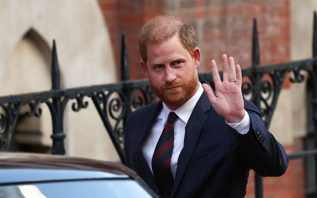 Britain's Prince Harry, Duke of Sussex waves as he departs the the Royal Courts of Justice, Britain's High Court, in central London, on April 9, 2025 following the second day of his appeal hearing to over the downgrading of his personal security during visits in Britain. Prince Harry's lawyer outlined in court threats made against him, including calls for his murder, as King Charles's youngest son appealed on April 8, 2025 against an "unjustified" decision to restrict his police protection in the UK. (Photo by HENRY NICHOLLS / AFP)