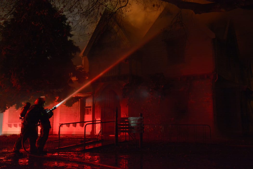 Firefighters tackle the blaze at Christchurch's 152-year-old Risingholme Community Centre.