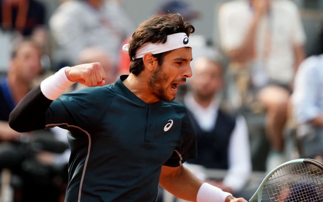 Italy's Lorenzo Musetti reacts after a point during his men's singles quarter-final match against US Frances Tiafoe on day 10 of the French Open tennis tournament on Court Philippe-Chatrier at the Roland-Garros Complex in Paris on June 3, 2025. (Photo by Dimitar DILKOFF / AFP)