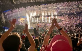 Looking at the stadium stage, over the heads of the crowd, at the Eurovision Song Quest semi-finals in Liverpool.