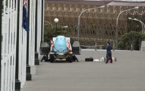 Police check the vehicle at Parliament.