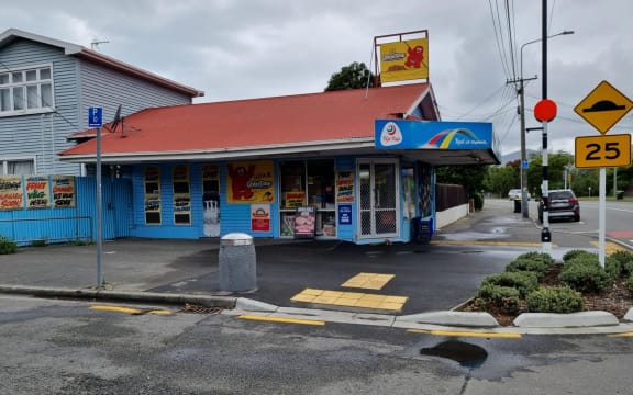 Flowers outside the Opawa Discounter, where the business' owner was stabbed during a robbery on 2 December. Christchurch