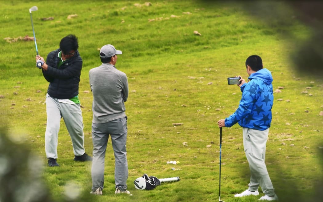 Golfers at Gulf Harbour Country Club.