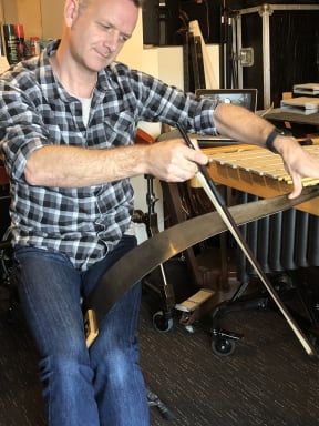 Jeremy Fitzsimons plays the musical saw