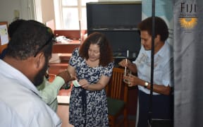 Staff from the Otago and Fiji museums at the Far From Frozen Exhibition in Suva.