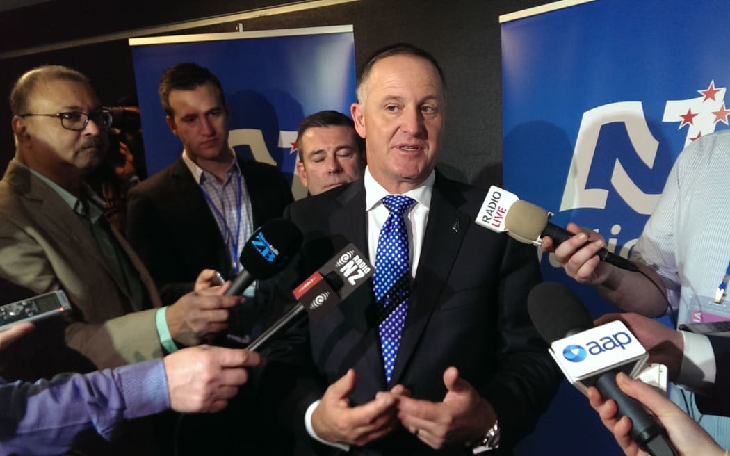 John Key talking to media after his leader's speech.