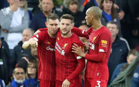 James Milner, Adam Lallana and Fabinho of Liverpool.