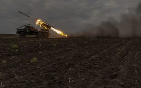 Ukrainian servicemen of the 92nd Assault Brigade fire BM-21 'Grad' multiple rocket launcher toward Russian positions, in the Kharkiv region, on May 15, 2024, amid the Russian invasion of Ukraine. President Volodymyr Zelensky cancelled planned trips abroad over the fresh offensive and the military was sending more troops to Kharkiv to hold back Russian advances, Kyiv said.