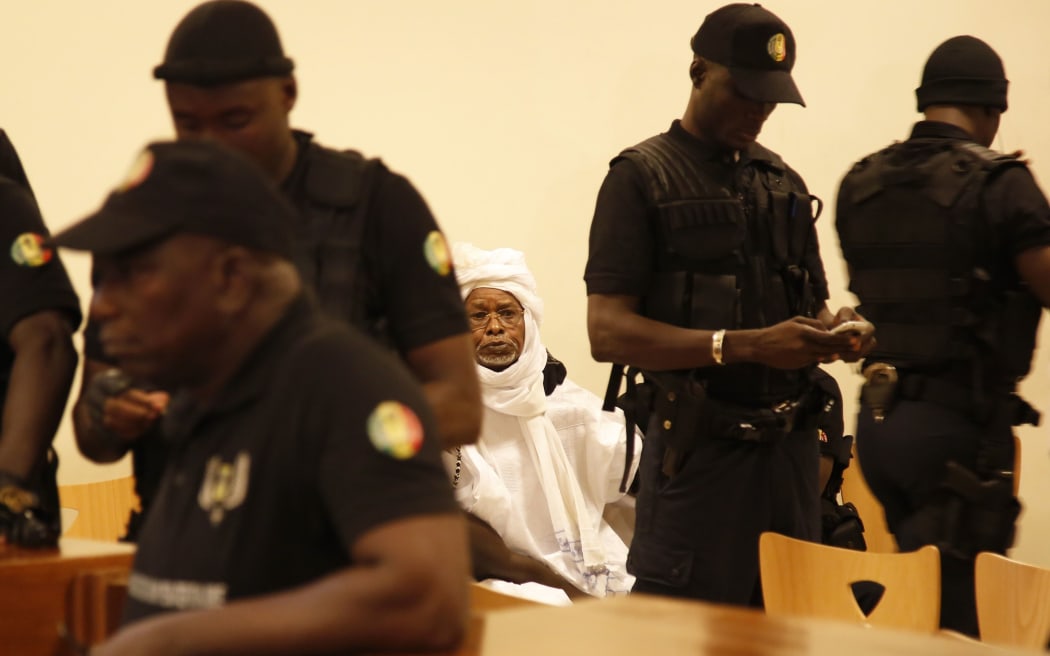 Hissene Habre is escorted in to stand trial at the Palais de Justice in Dakar, Senegal, Monday on July 20, 2015.
