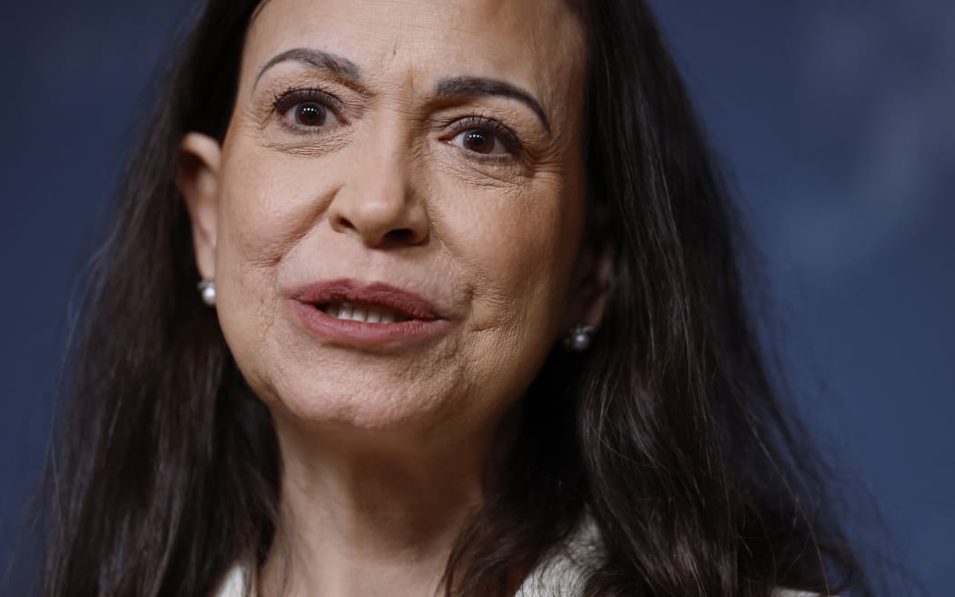 Nobel Peace Prize winner Maria Corina Machado addresses a press conference on December 11, 2025 at the Norwegian government's representative facilities in Oslo. Machado arrived in the Norwegian capital hours after the Venezuelan opposition leader's award was collected on her behalf by her daughter. (Photo by Odd ANDERSEN / AFP)