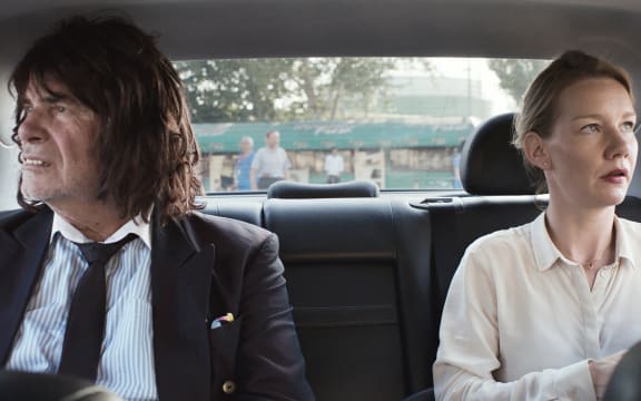 Peter Simonischek and Sandra Hüller on their way to another important business meeting in Toni Erdmann