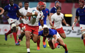 Tongas captain Siale Piutau finds some open space.