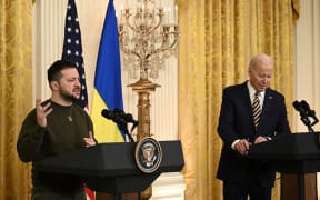 US President Joe Biden and Ukraine's President Volodymyr Zelensky hold a press conference in the East Room of the White House in Washington, DC, on December 21, 2022.