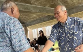 Delegate Gregorio Kilili Sablan shakes hands with Lt. Gov. David M. Apatang during his last townhall meeting last Wednesday at the NMI Museum of History and Culture on Saipan.