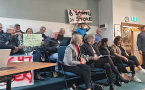 People in the public gallery of the Nelson City Council chambers, supporting a motion to withdraw Plan Change 29.