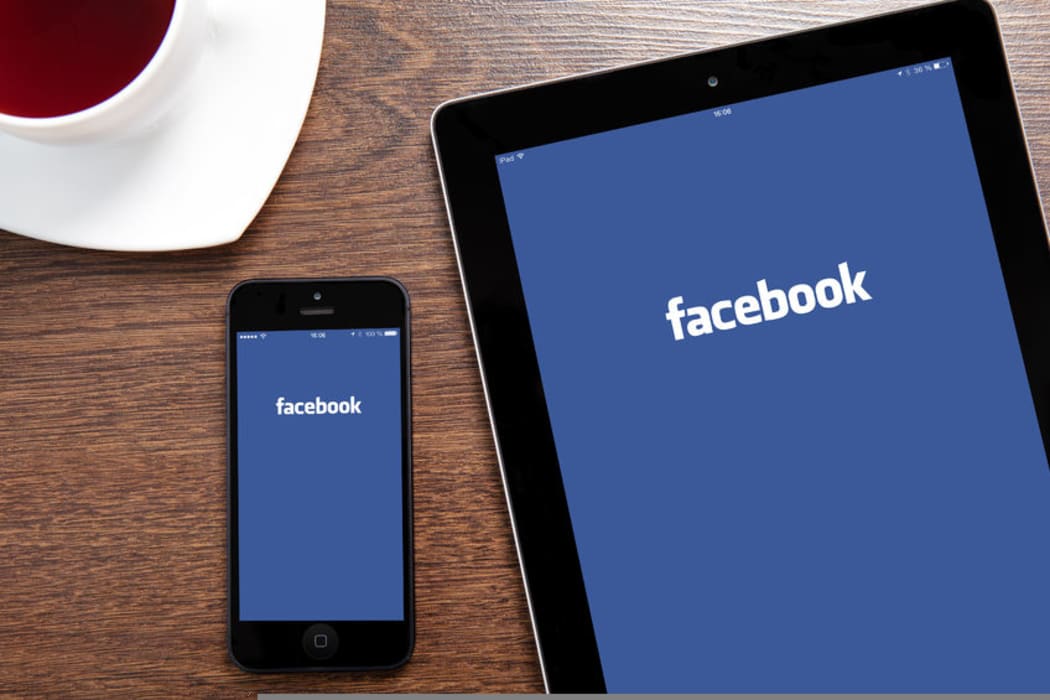 Facebook showing on a phone and ipad.