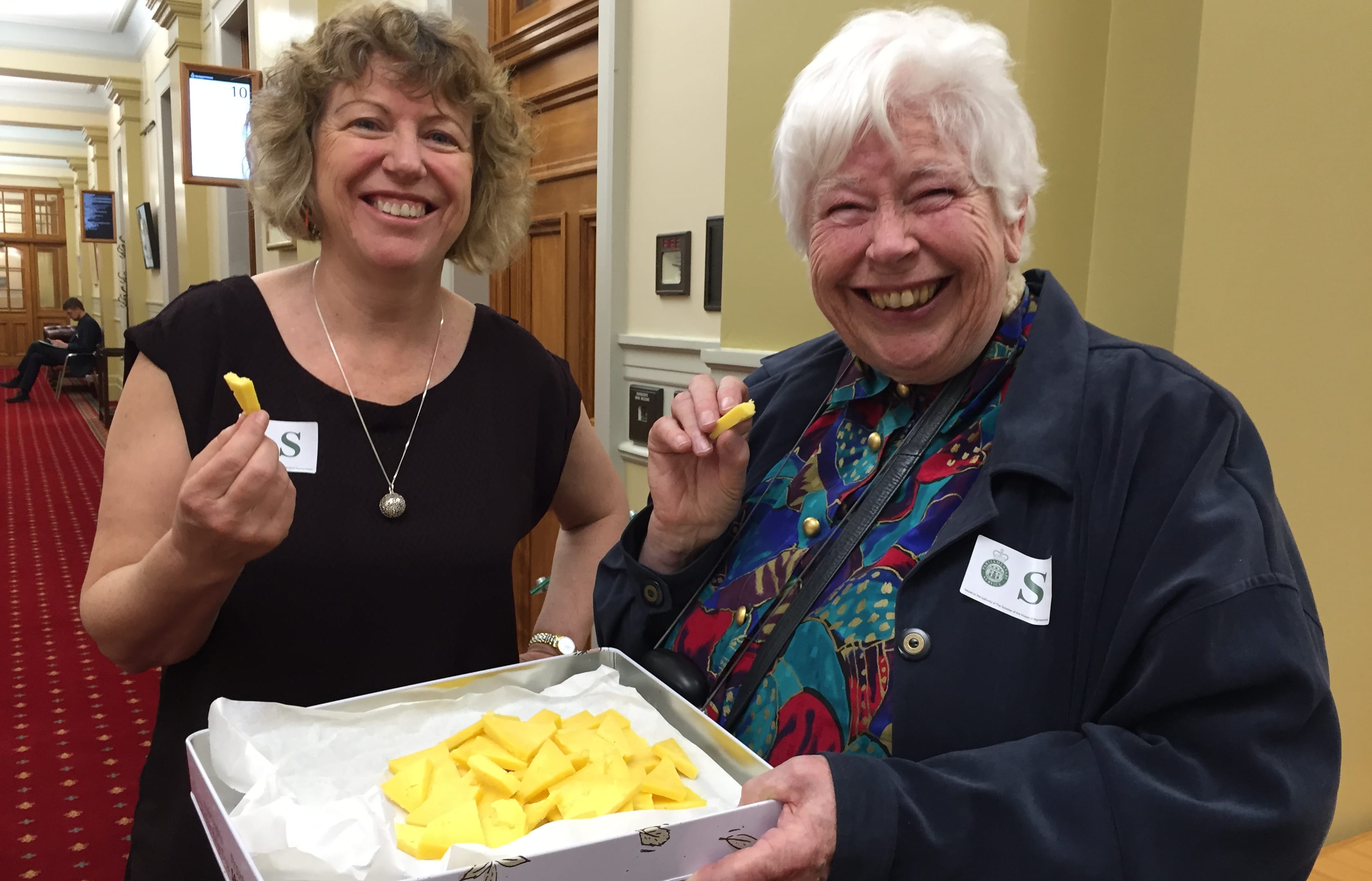Biddy Fraser Davies and Jill Whalley offered raw milk cheese to a select committee to taste.