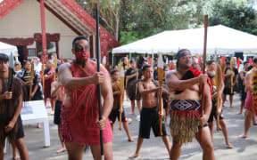 Politicians being welcomed onto Te Whare Runanga on the Treaty grounds at Waitangi.