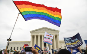 (File photo) Demonstrators in favour of LGBT rights rally outside the US Supreme Court in Washington, DC, in October 2019 as the court considers three cases dealing with workplace discrimination based on sexual orientation.
