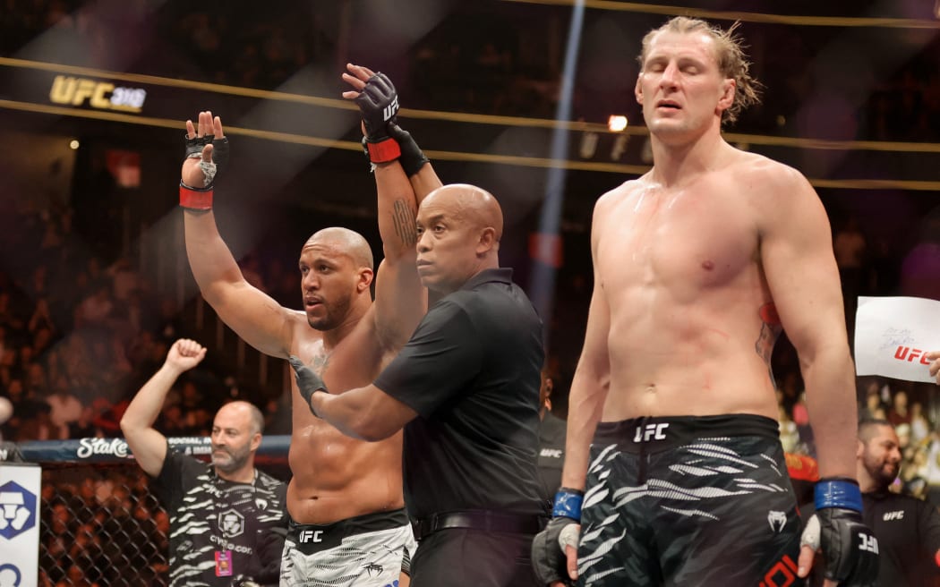 LAS VEGAS, NEVADA - DECEMBER 07: Ciryl Gane of France celebrates after his victory by split decision against Alexander Volkov of Russia in a heavyweight fight during UFC 310 at T-Mobile Arena on December 07, 2024 in Las Vegas, Nevada.   Steve Marcus/Getty Images/AFP (Photo by Steve Marcus / GETTY IMAGES NORTH AMERICA / Getty Images via AFP)