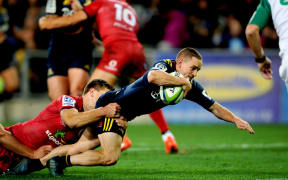Kayne Hammington of the Highlanders dives for a try during the Super Rugby match against the Reds at Forsyth Barr Stadium.