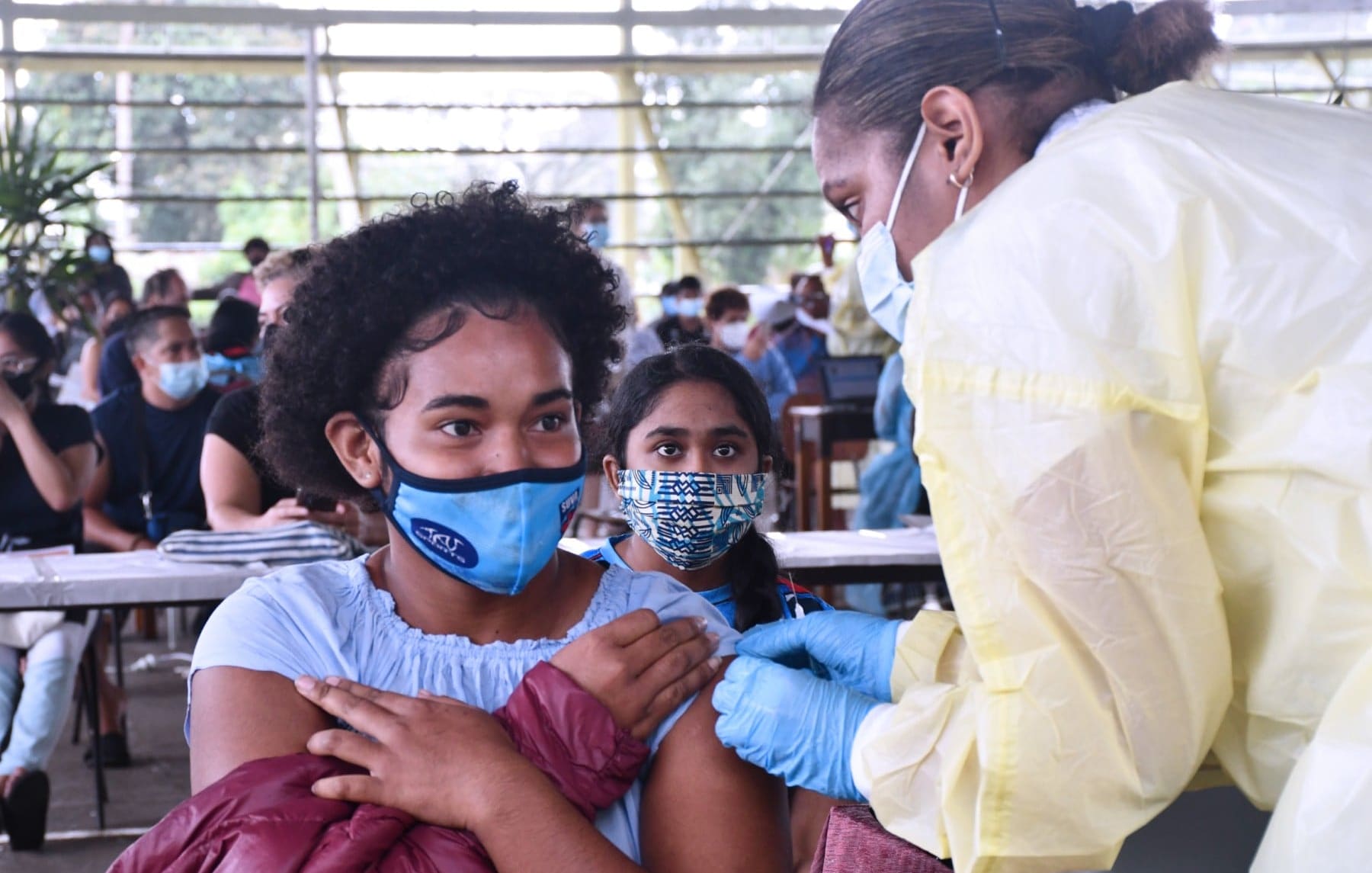 Children and teens being vaccinated in Fiji.