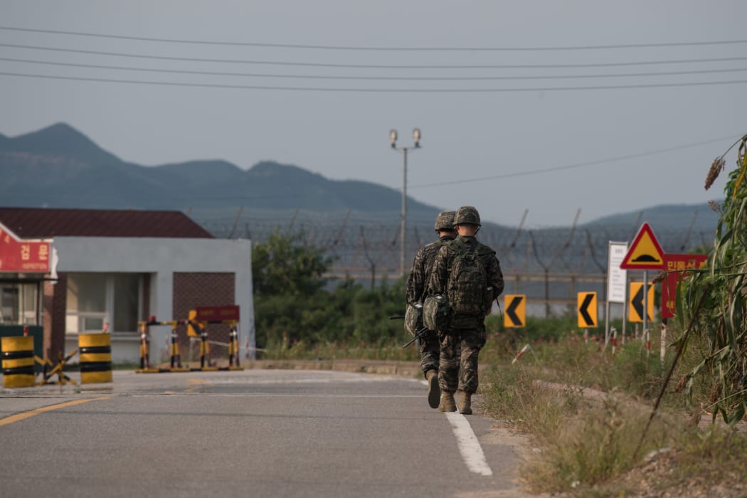 South Korean soldiers walk to a checkpoint at the Demilitarized zone (DMZ) separating North and South Korea, on Ganghwa island.