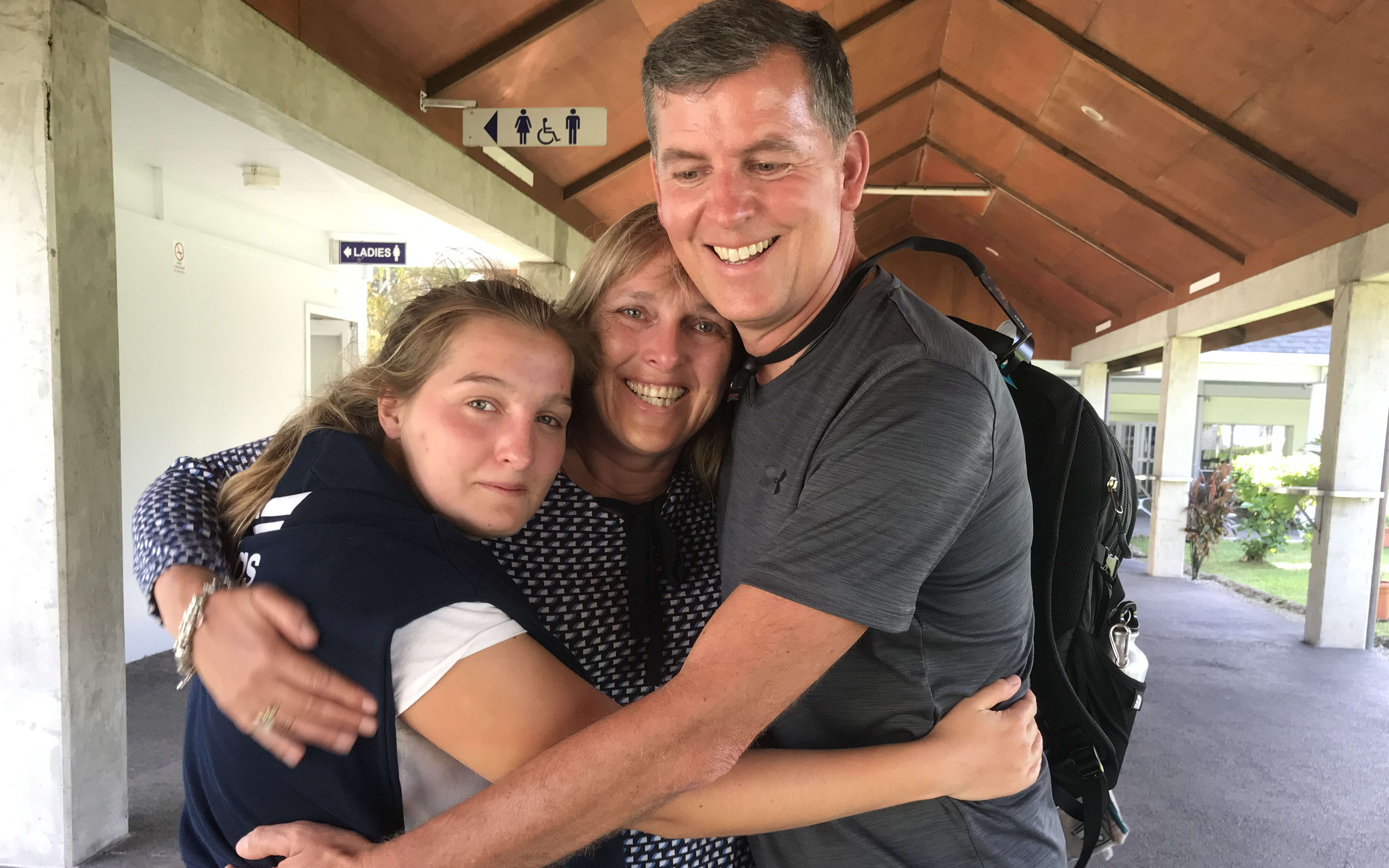 Caja Heinrich with her parents before they caught a flight back to Germany.