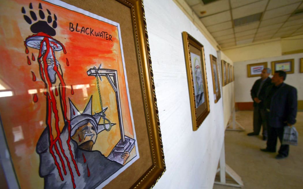A cartoon against US security firm Blackwater exhibited in Karbala in 2011.