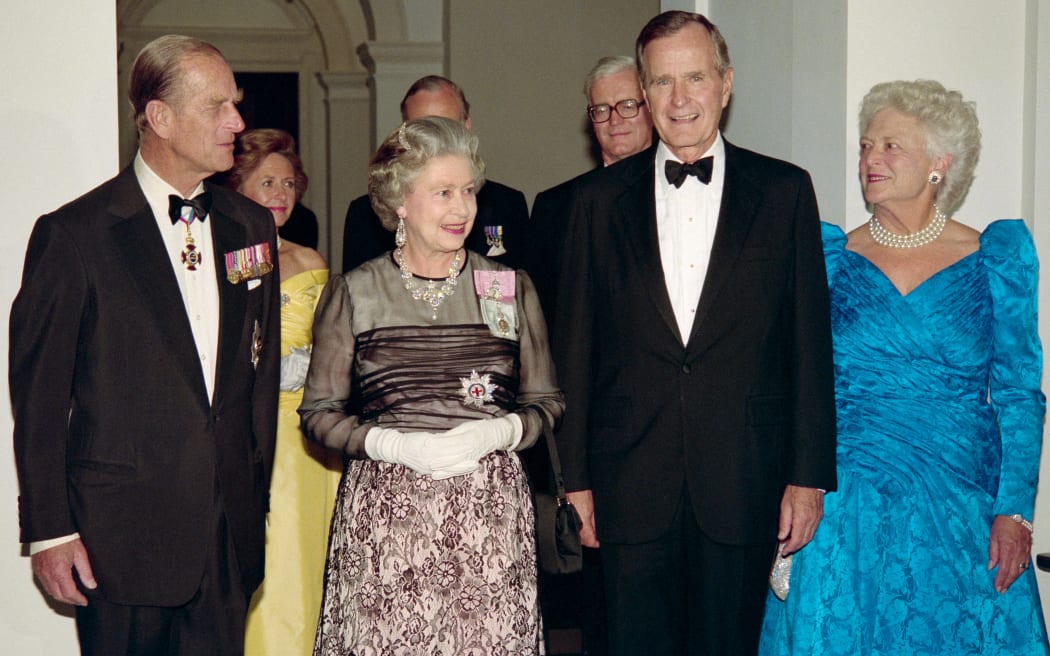 A May 1991 photo shows US President George Bush (2nd R) and First Lady Barbara Bush (R) at a reciprocal dinner at the British Embassy in Washington DC, accompanied by Britain's Queen Elizabeth II (2nd L) and her husband, Prince Philip (L).