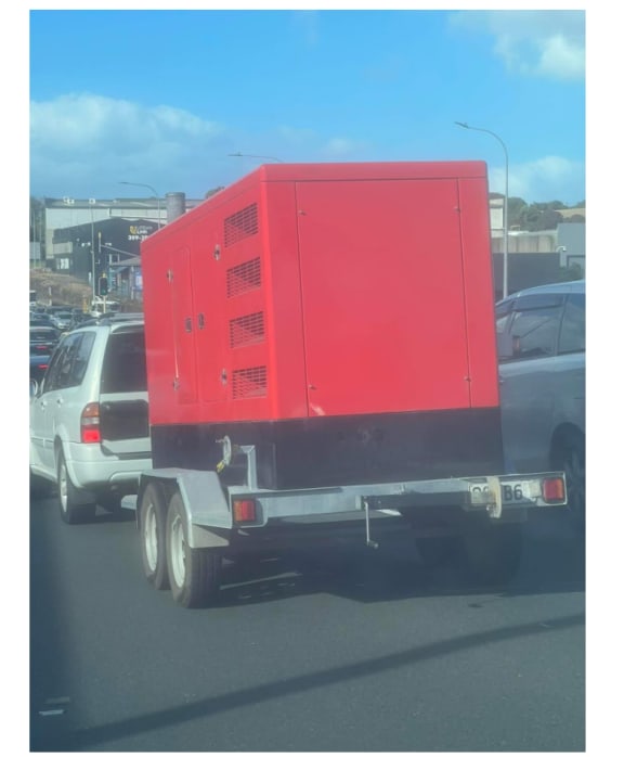 A 140kva generator sitting on a trailer.