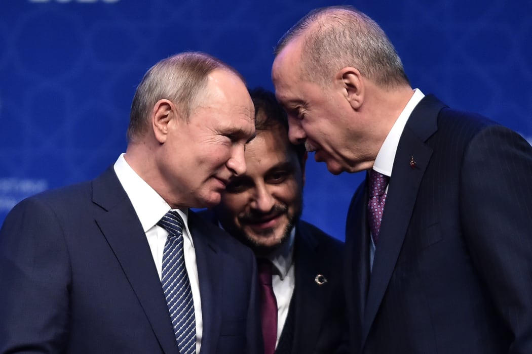Russian President Vladimir Putin (L) and Turkish President Recep Tayyip Erdogan (R) speak as they attend an inauguration ceremony of a new gas pipeline.
