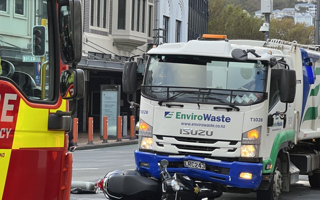 One person was taken to hospital after a collision between a motorcycle and truck at the corner of Courtenay Place and Tory Street, Wellington, 11 April 2023.