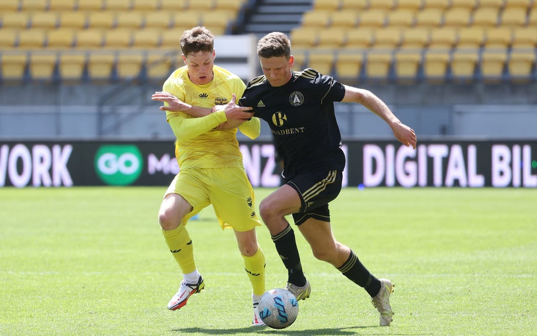 Auckland United's Will Stephen (R) with Phoenix Reserves Fin Conchie during the 2022 National League Championship