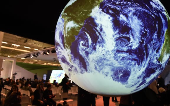 People visit the American display at COP21, the United Nations conference on climate change at Le Bourget.